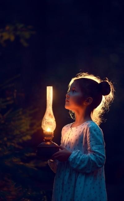 girl holding an oil lamp